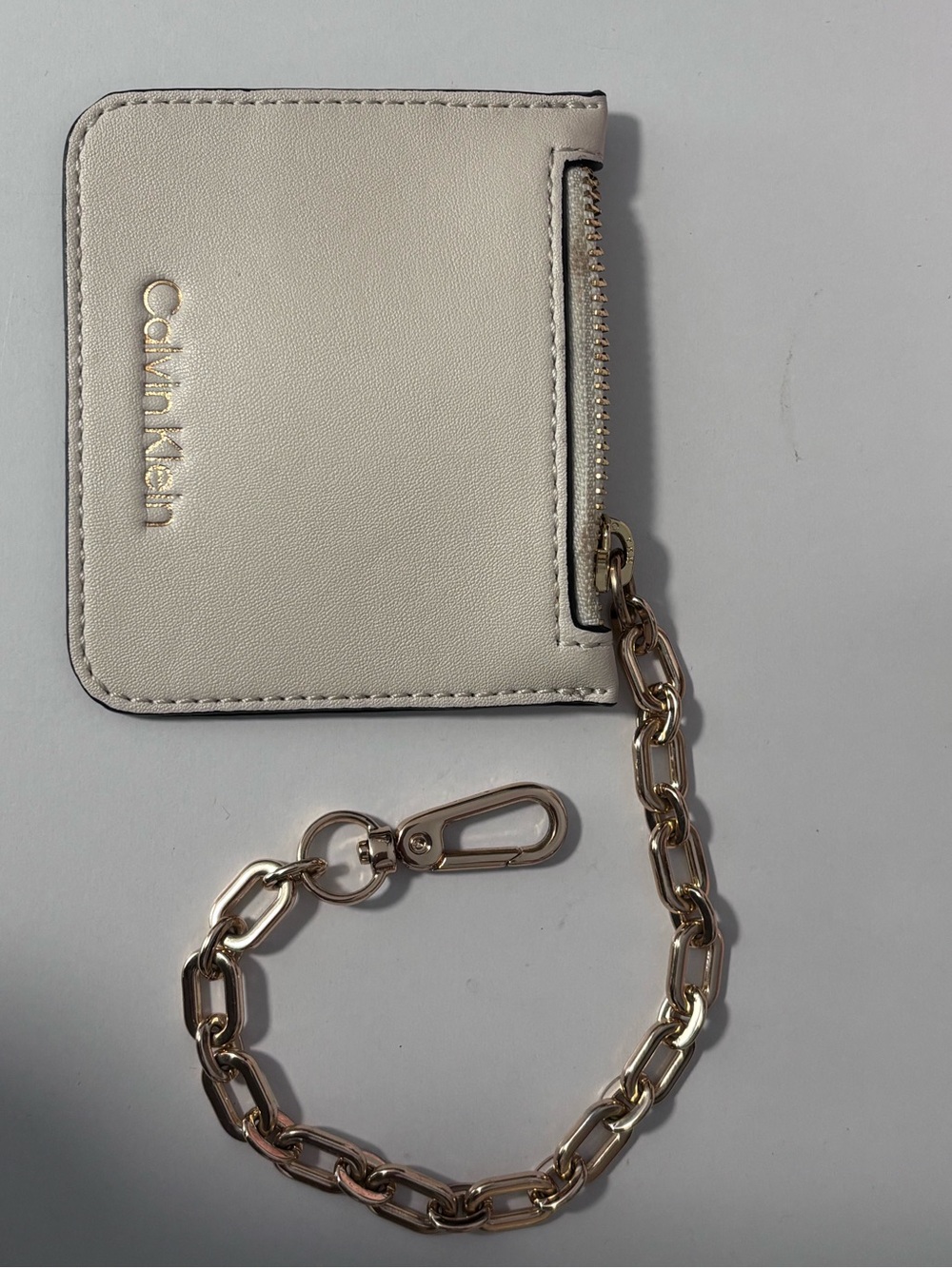Calvin Klein Cream Card Holder with Gold Chain Accent